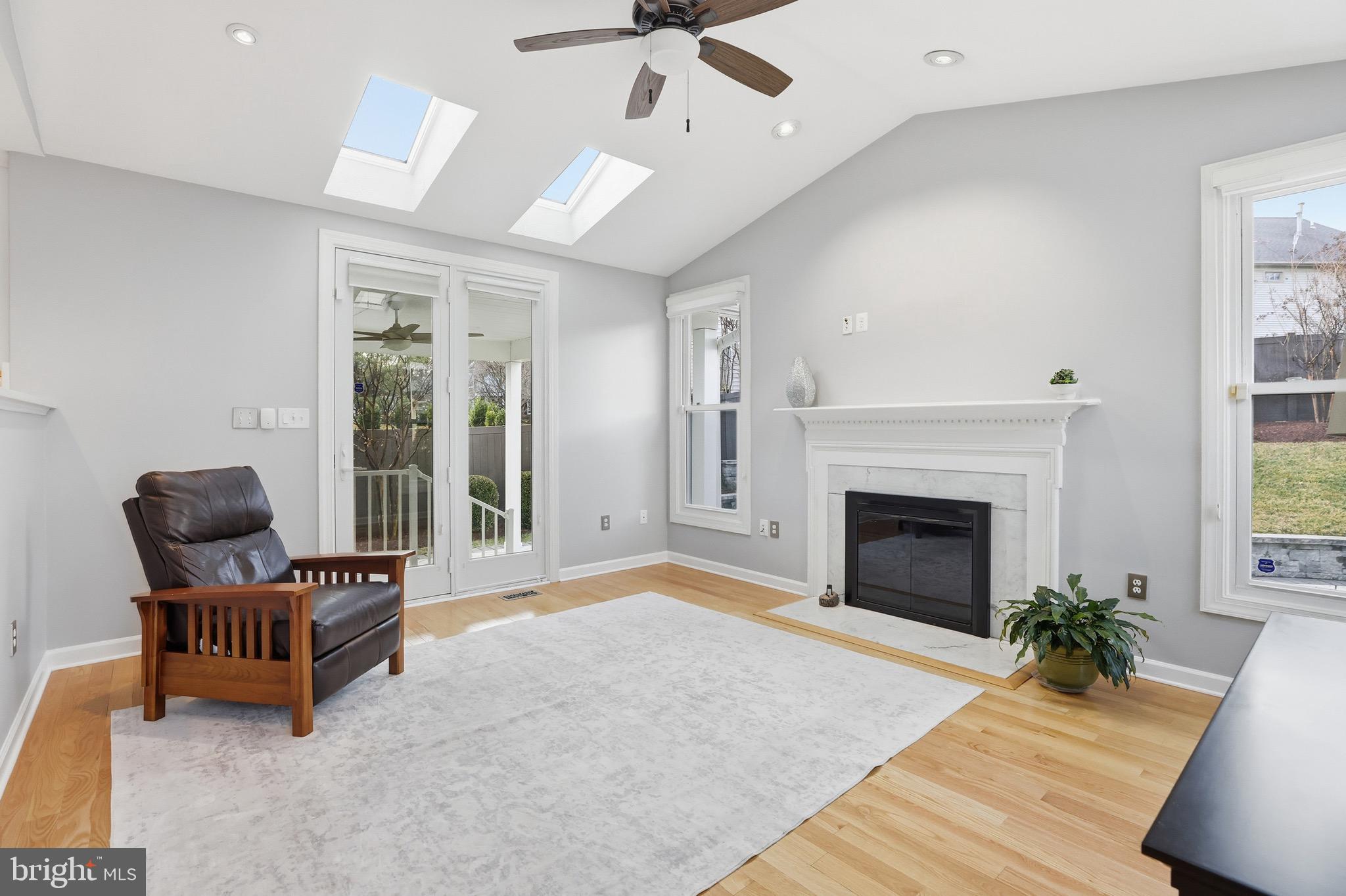 13222 Maplecrest Drive Potomac, MD 20854 - Photo 17 of 61 a living room with furniture and a fireplace