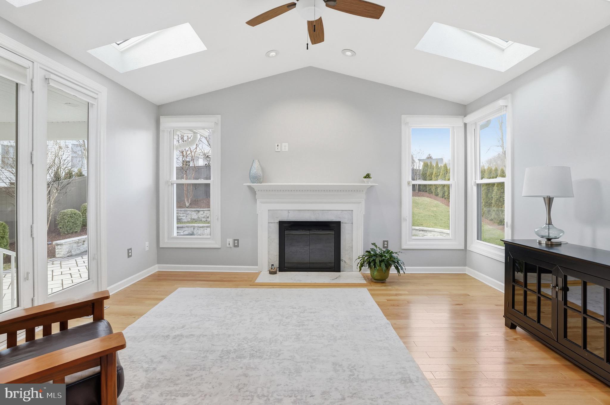 13222 Maplecrest Drive Potomac, MD 20854 - Photo 19 of 61 a living room with furniture and a fireplace