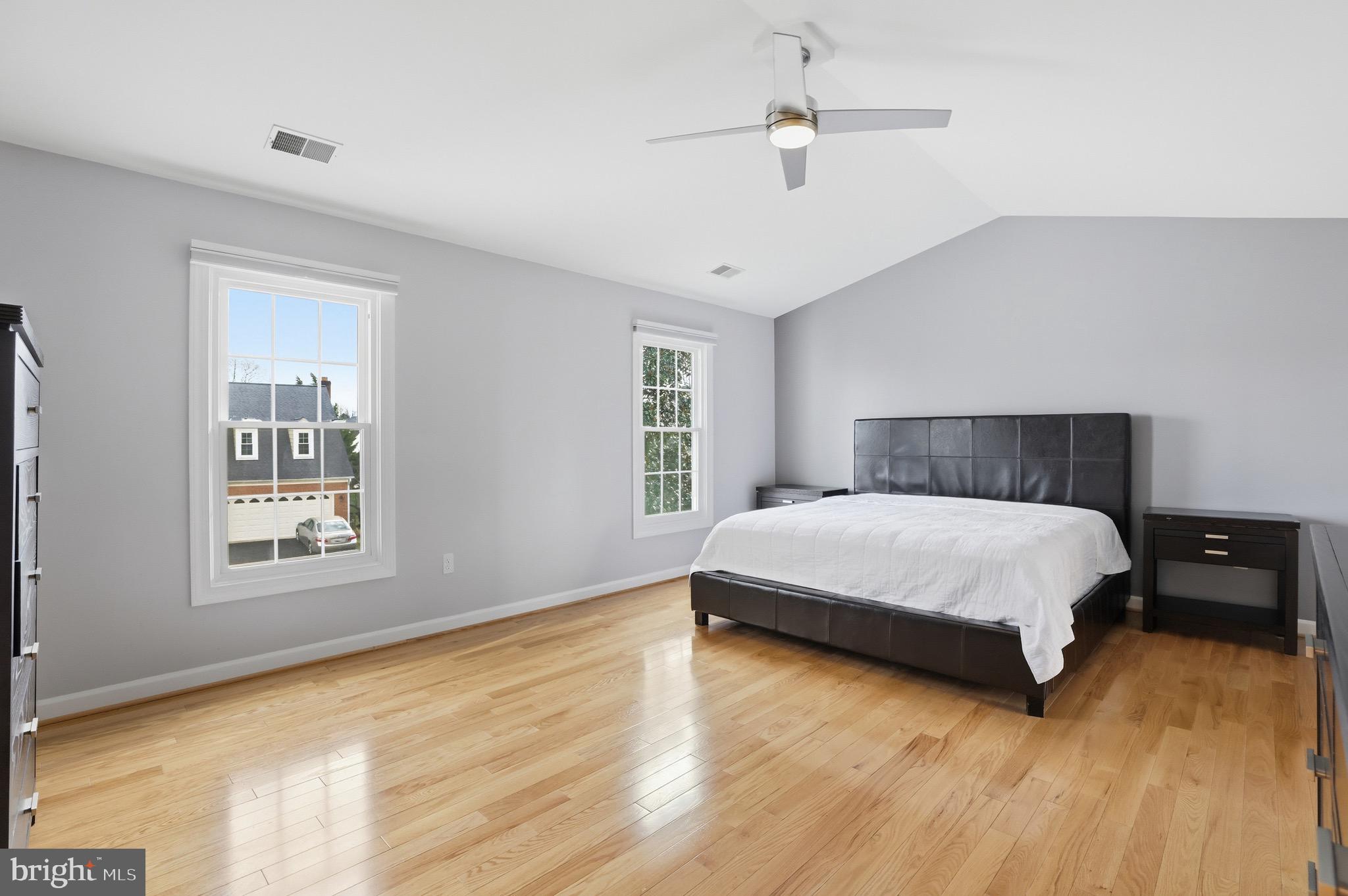 13222 Maplecrest Drive Potomac, MD 20854 - Photo 24 of 61 a bedroom with a bed and wooden floor