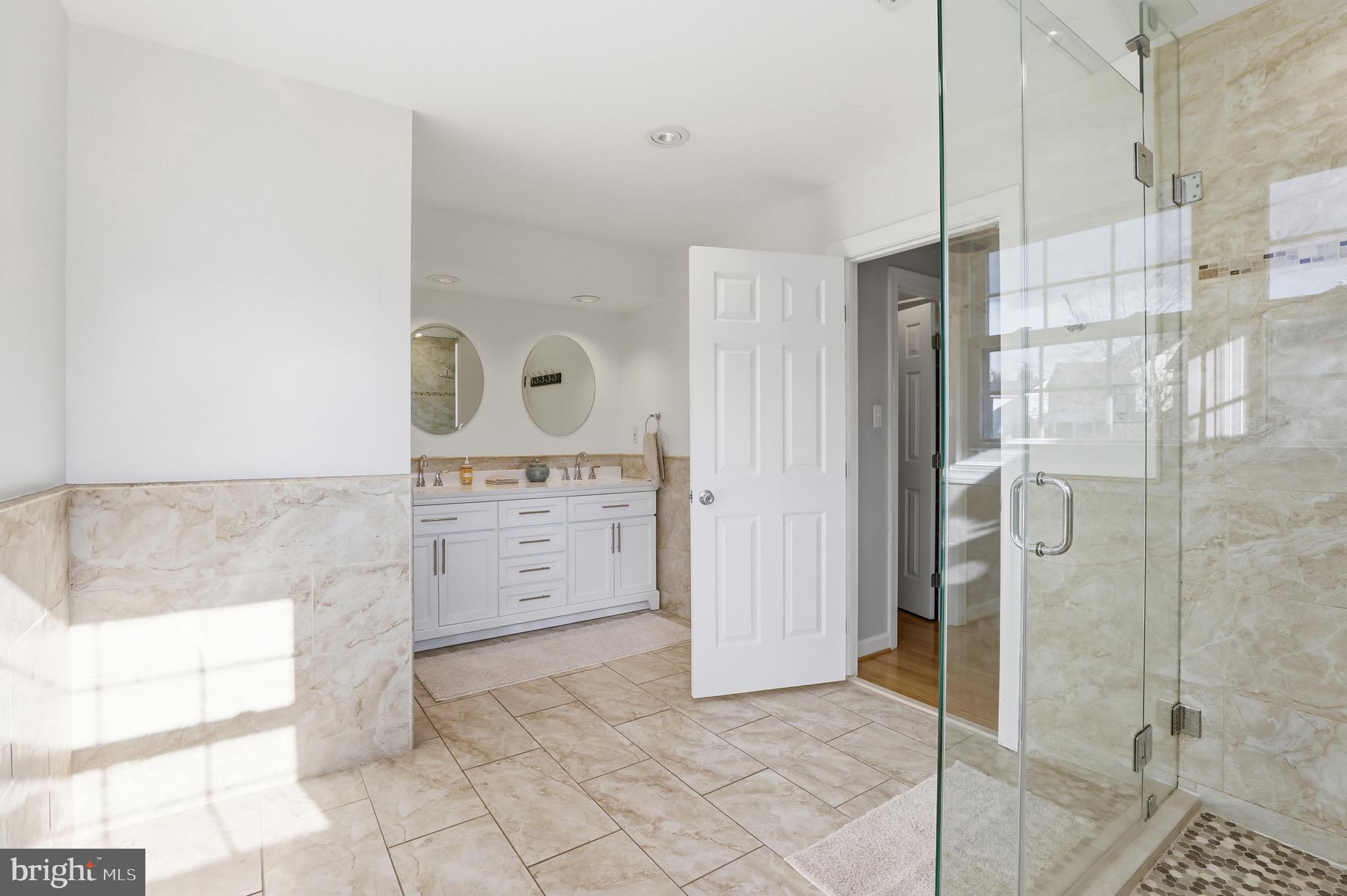13222 Maplecrest Drive Potomac, MD 20854 - Photo 30 of 61 a bathroom with a shower and a sink