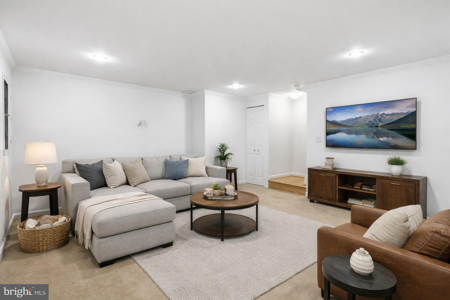 13222 Maplecrest Drive Potomac, MD 20854 - Photo 41 of 61 a living room with furniture and a flat screen tv