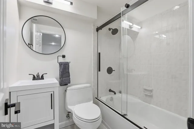 a view of a porch with chairs and backyard