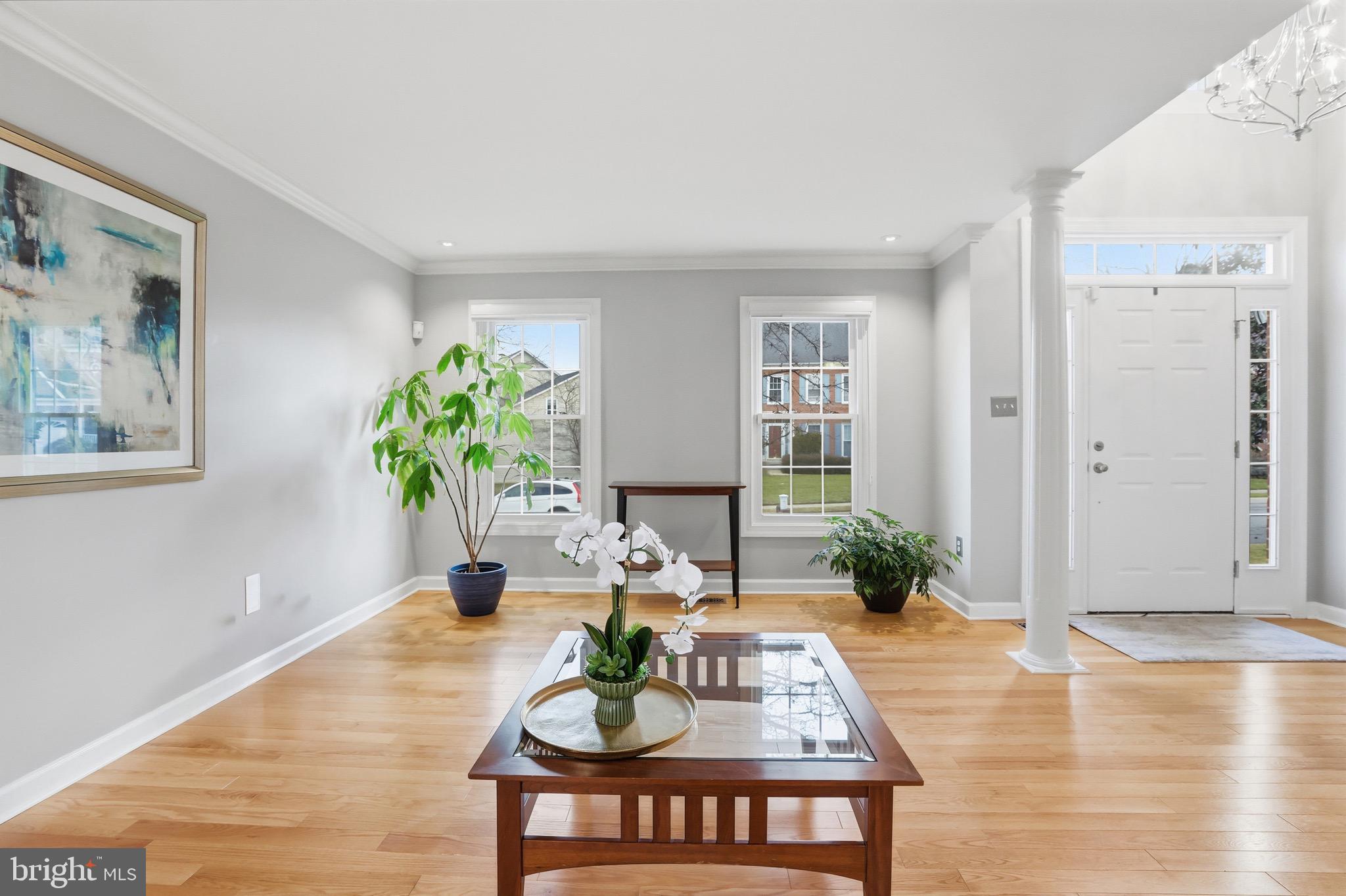 13222 Maplecrest Drive Potomac, MD 20854 - Photo 7 of 61 a living room with furniture potted plant and a window