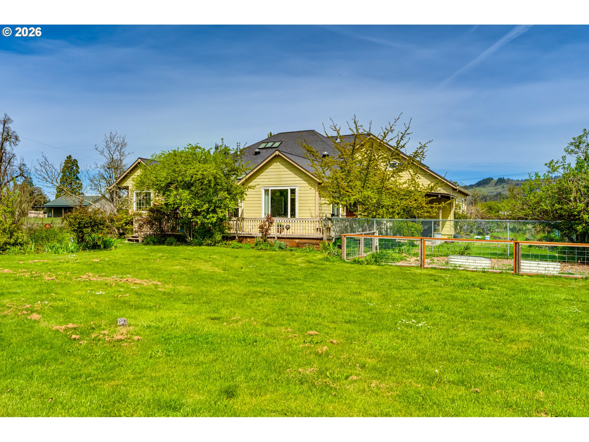 34386 Mathews Road Eugene, OR 97405 - Photo 21 of 48 a view of an house with backyard space and garden