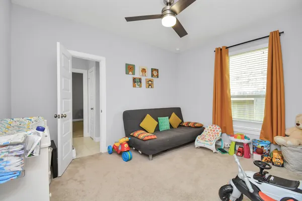 a bedroom with furniture and a window