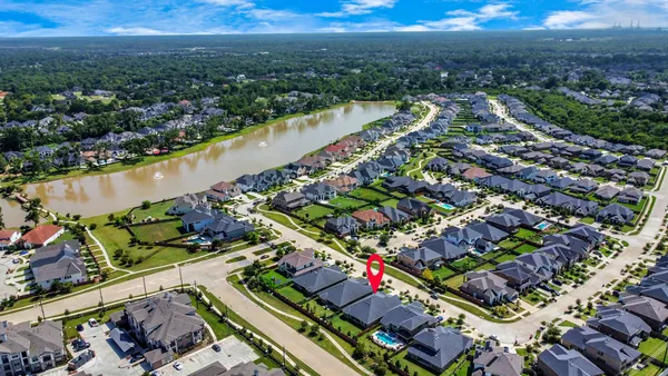 an aerial view of a city and lake view