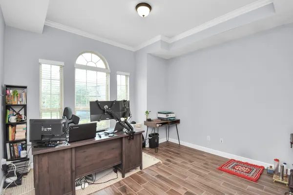 a workspace with furniture and a window