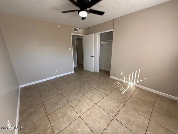 a view of an empty room with a window