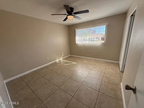 a view of an empty room and window