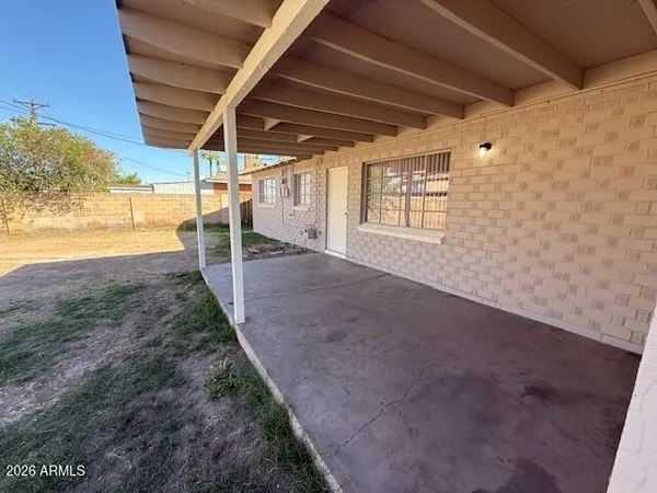 a view of a backyard of the house