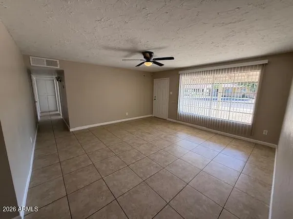 a view of an empty room with a window