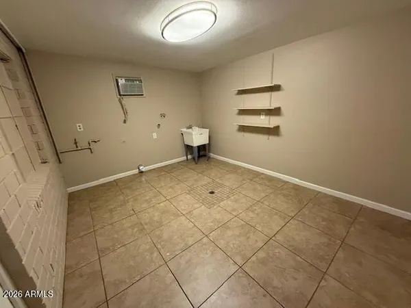 an empty room with white walls