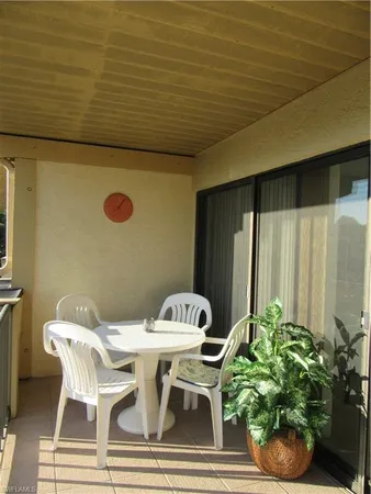 a outdoor dining space with furniture