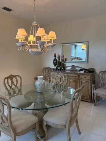 a kitchen with a refrigerator and cabinets