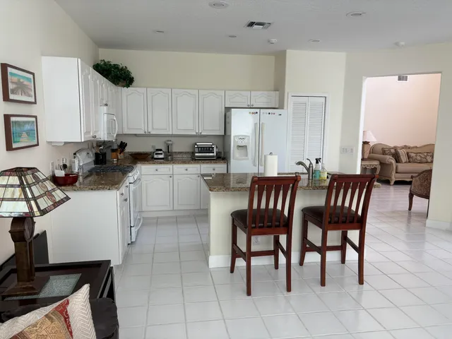 a bedroom with a bed window and couch