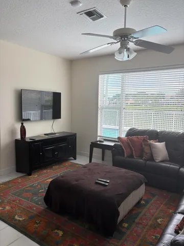 a living room with a couch and a large window