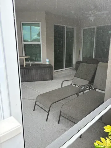a view of a wooden deck and a garden