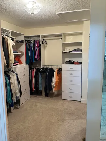 a bed room with a bed and a large window