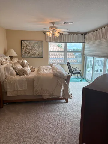 a spacious bathroom with a tub sink and mirror