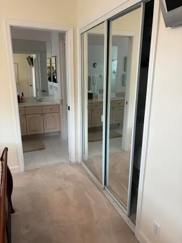 a bedroom with furniture and a flat screen tv