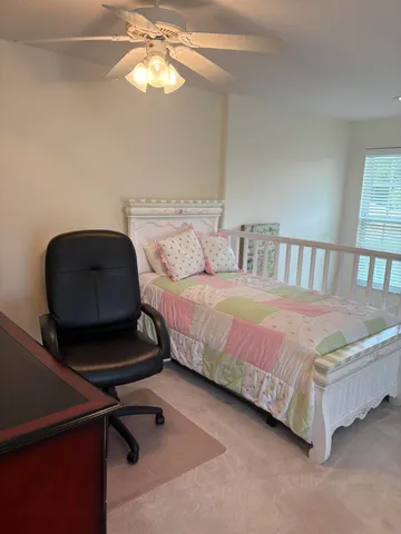 a bedroom with a bed and window