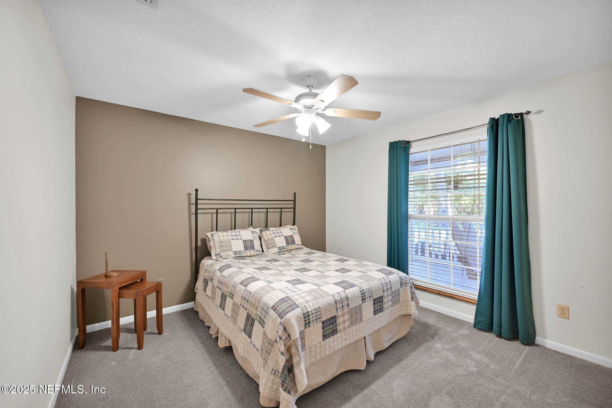 3541 Pacetti Road St. Augustine, FL 32092 - Photo 16 of 74 a bedroom with a bed and a ceiling fan