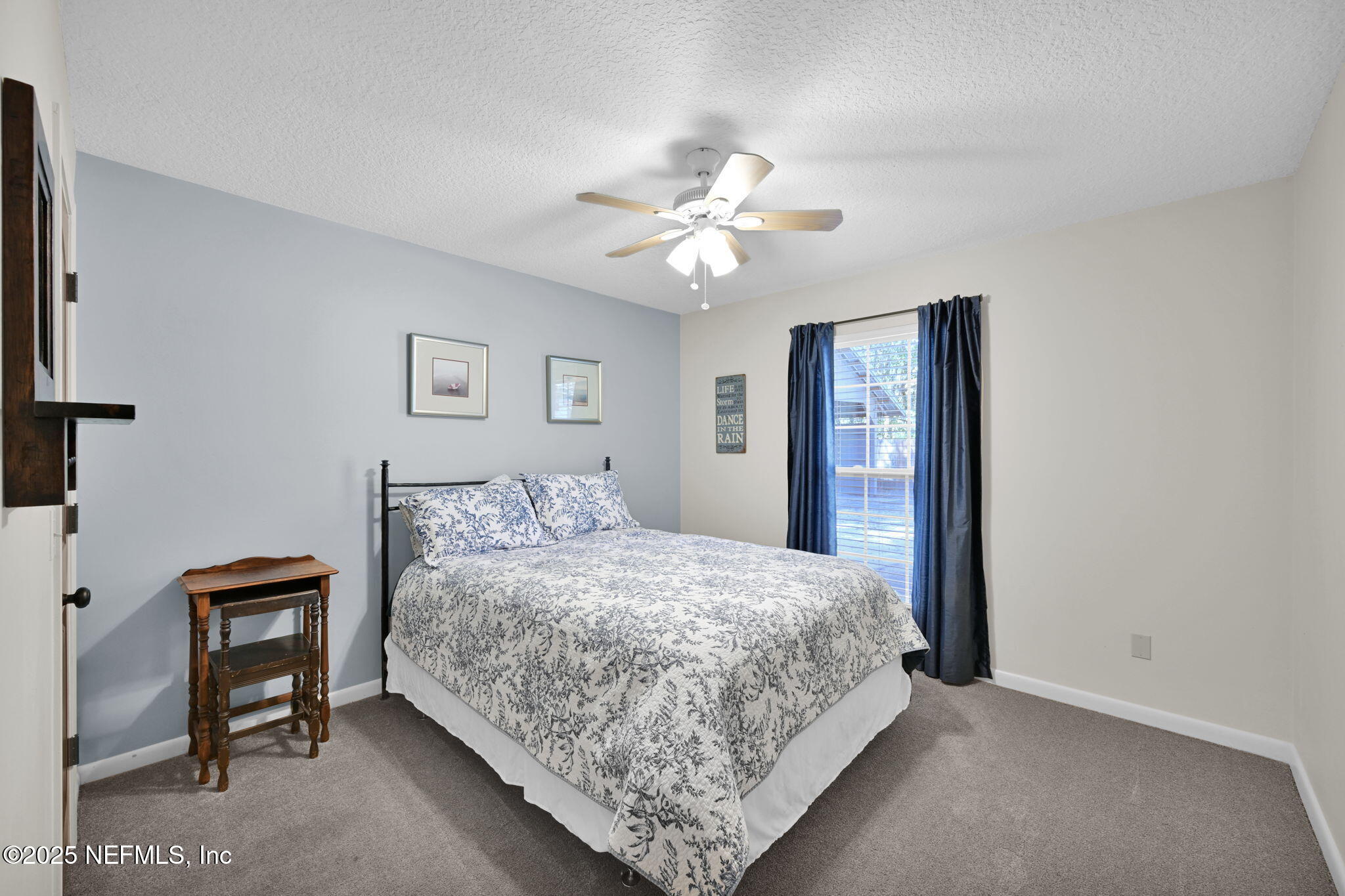 3541 Pacetti Road St. Augustine, FL 32092 - Photo 17 of 74 a bedroom with a bed and a chandelier