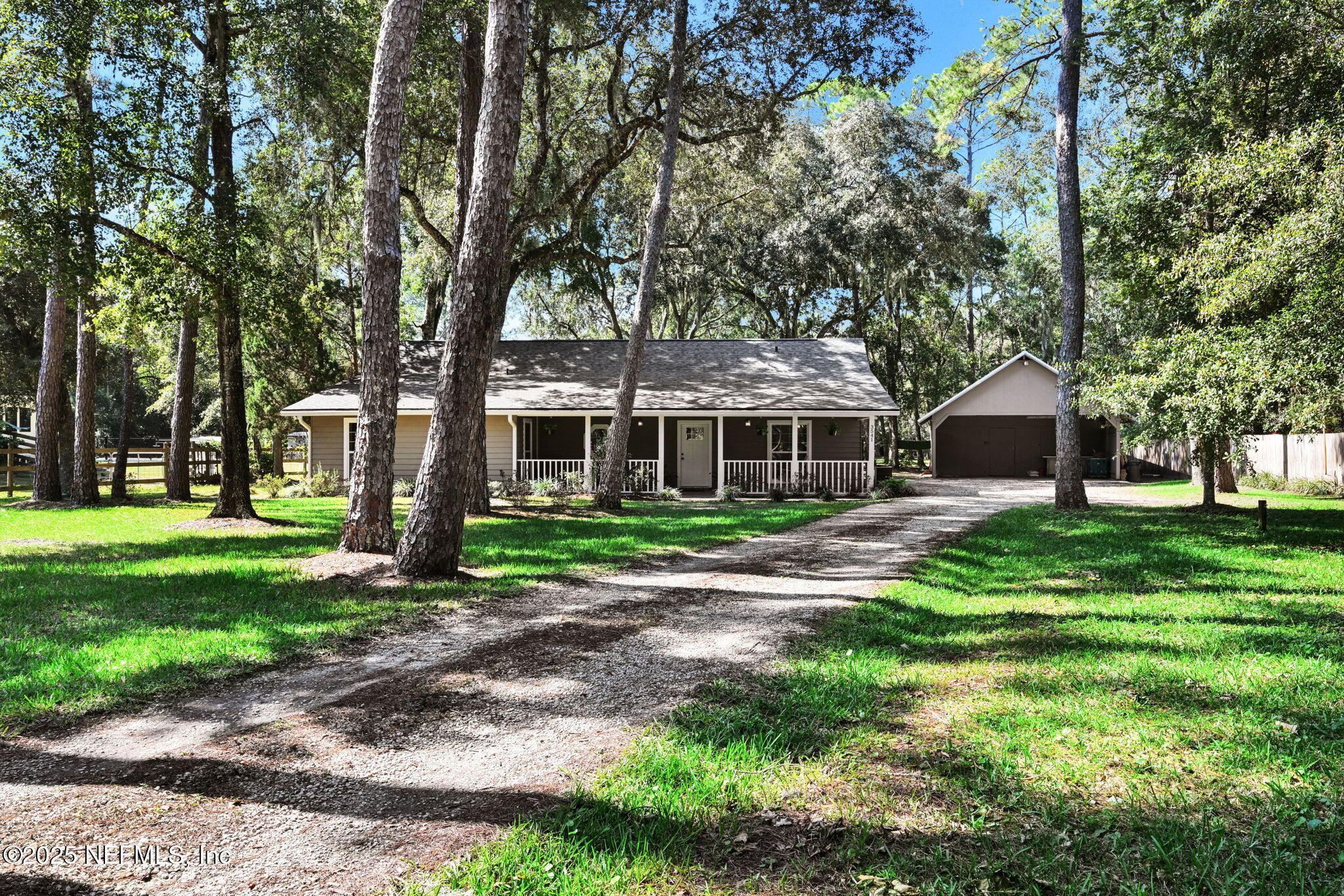 3541 Pacetti Road St. Augustine, FL 32092 - Photo 23 of 74 a front view of a house with a yard and trees