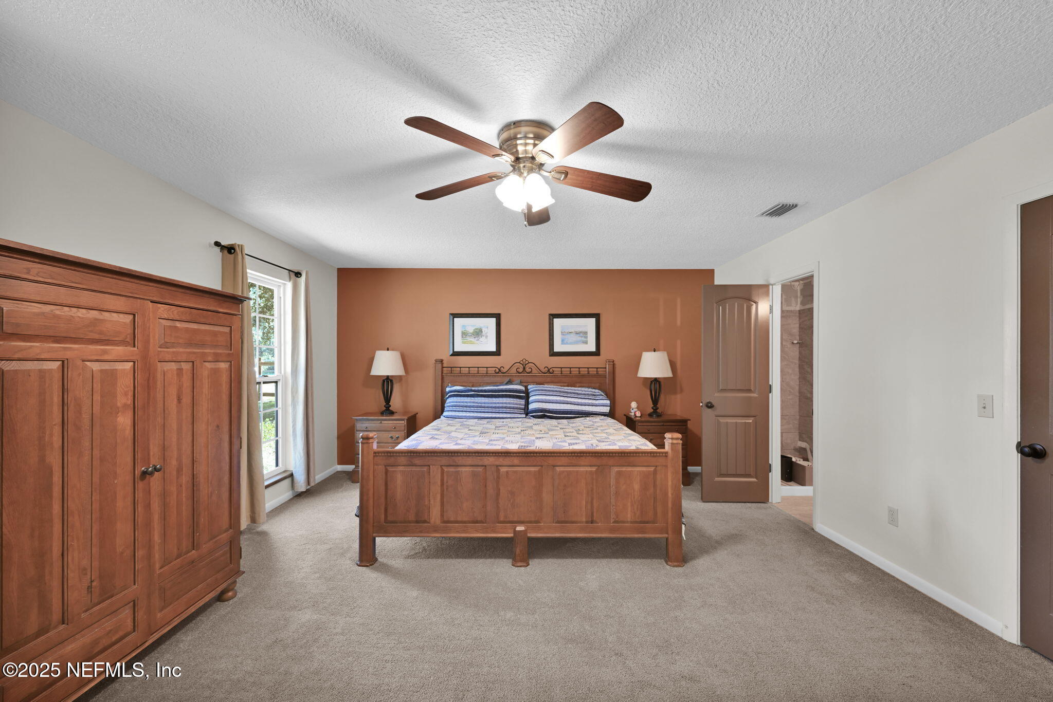 3541 Pacetti Road St. Augustine, FL 32092 - Photo 33 of 74 a living room with a bed furniture and ceiling fan