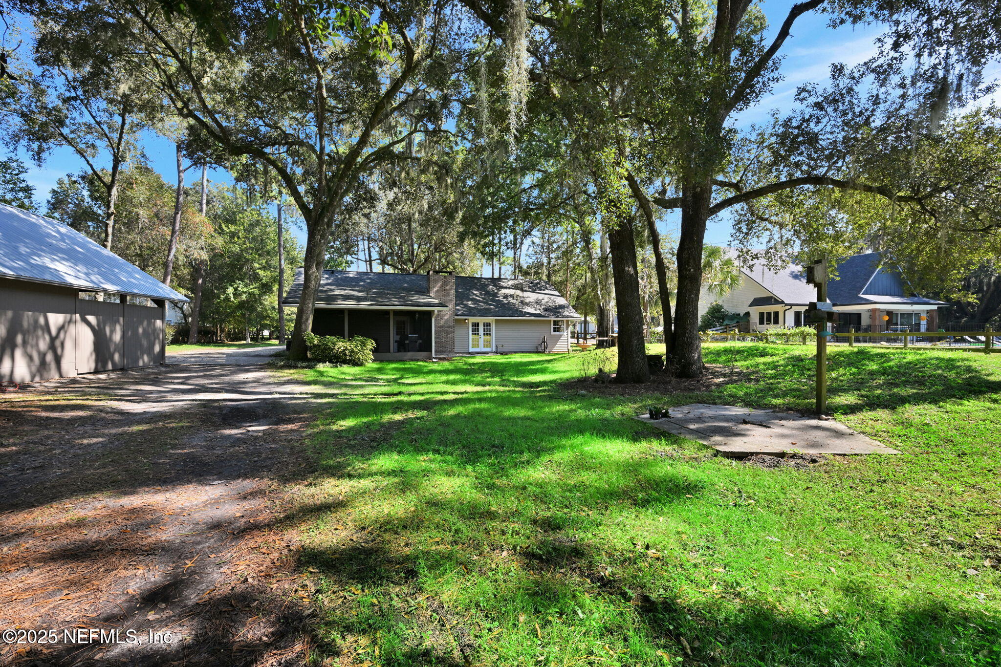 3541 Pacetti Road St. Augustine, FL 32092 - Photo 39 of 74 a front view of a house with garden and trees