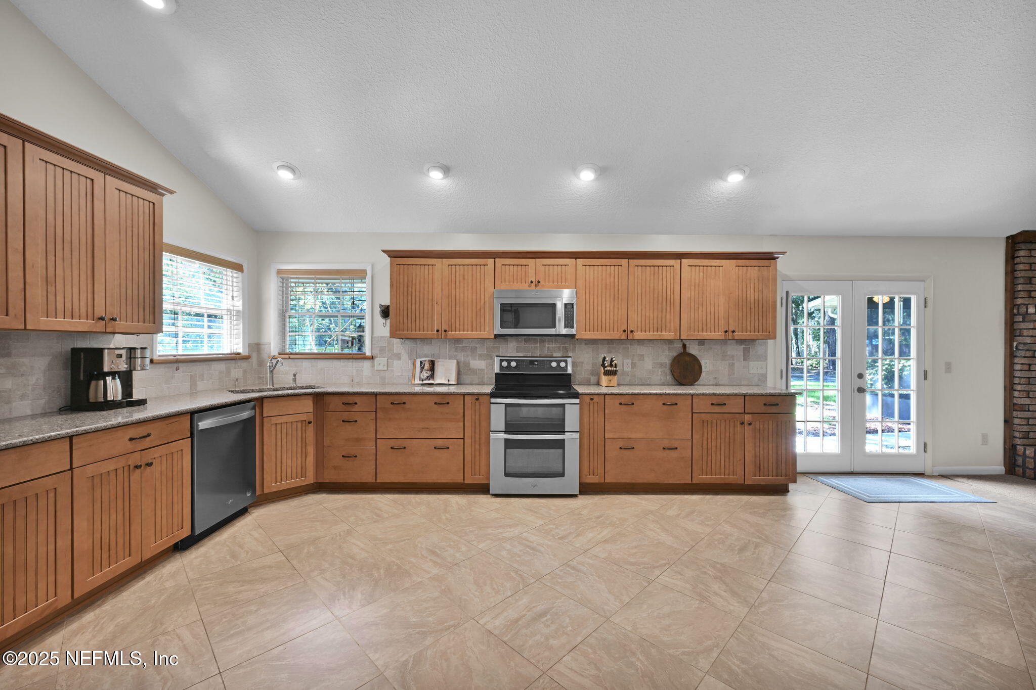3541 Pacetti Road St. Augustine, FL 32092 - Photo 4 of 74 a large kitchen with stainless steel appliances granite countertop a stove sink and cabinets
