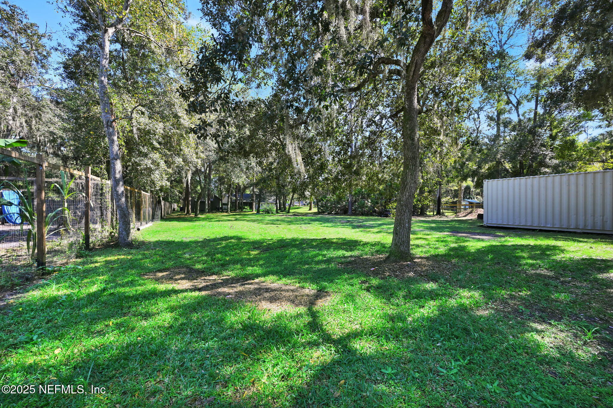 3541 Pacetti Road St. Augustine, FL 32092 - Photo 43 of 74 a view of a backyard with large trees
