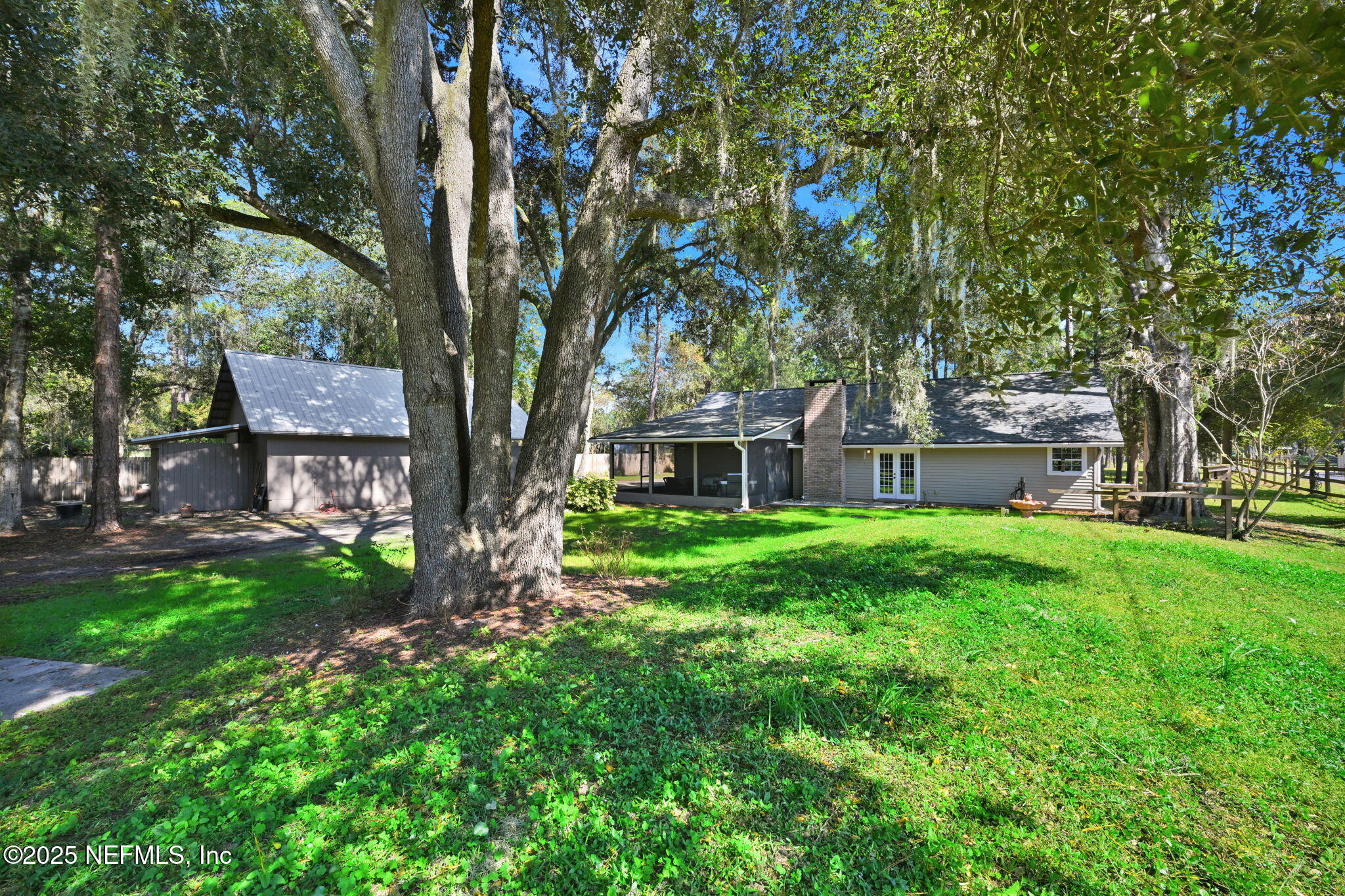 3541 Pacetti Road St. Augustine, FL 32092 - Photo 44 of 74 a view of a house with a tree in a yard