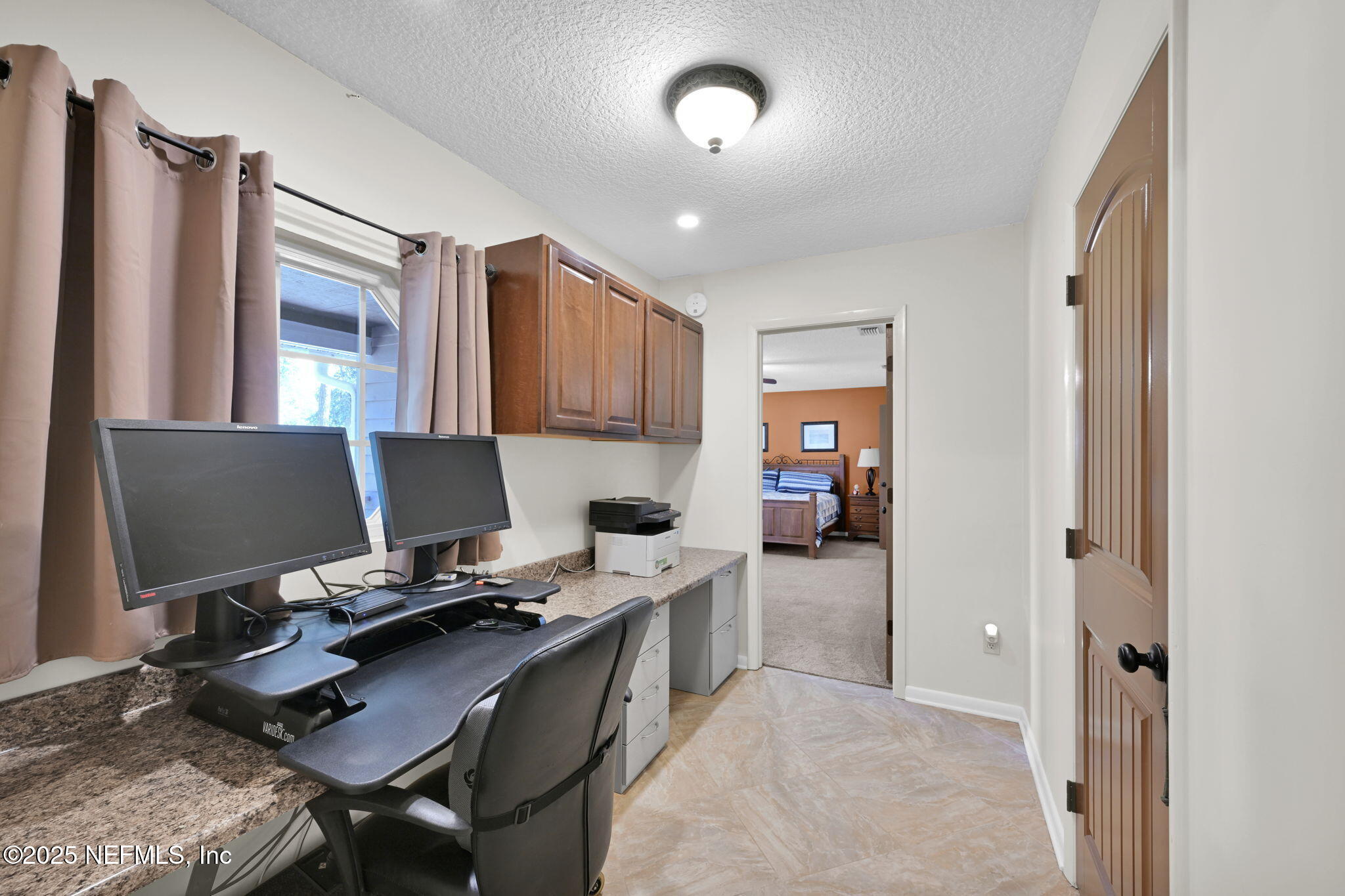 3541 Pacetti Road St. Augustine, FL 32092 - Photo 6 of 74 a workspace with a desk and chair