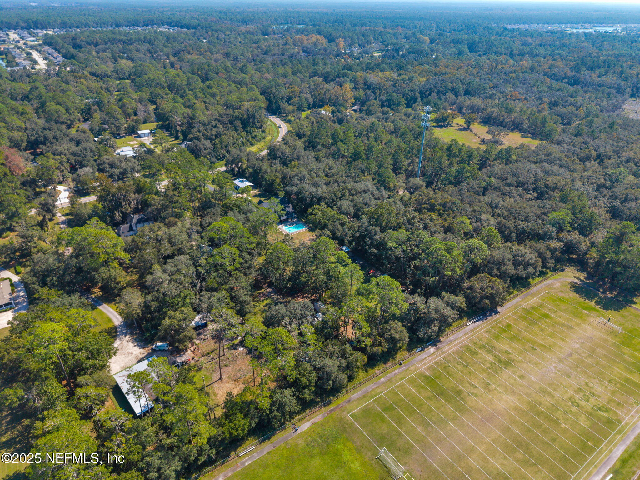 3541 Pacetti Road St. Augustine, FL 32092 - Photo 68 of 74 an aerial view of residential houses with outdoor space and trees