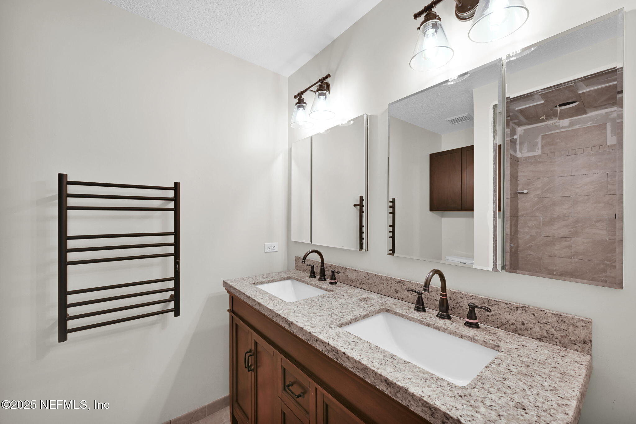 3541 Pacetti Road St. Augustine, FL 32092 - Photo 7 of 74 a bathroom with a granite countertop sink and a mirror