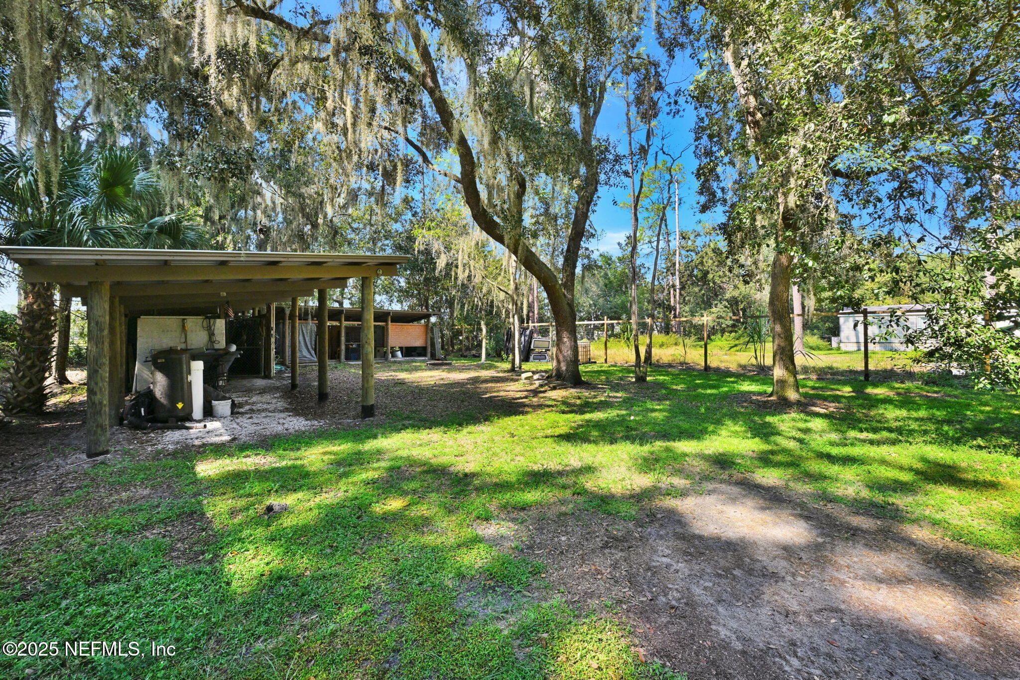 3541 Pacetti Road St. Augustine, FL 32092 - Photo 10 of 74 a view of a park with swings and a table and chairs