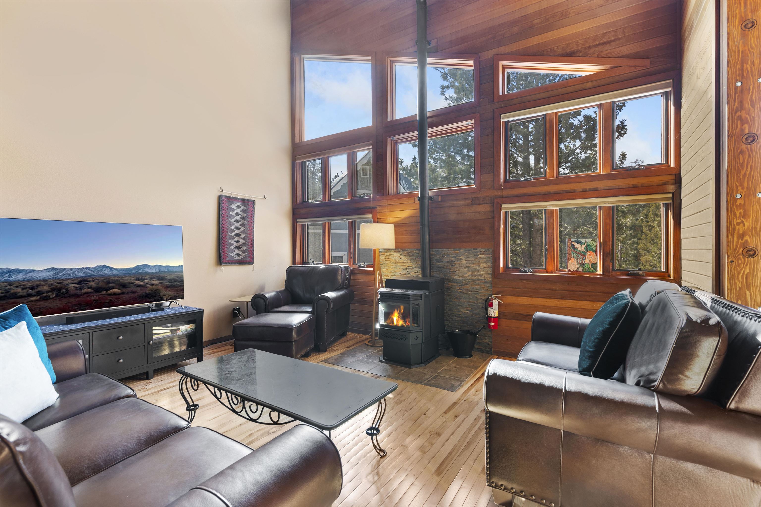 a living room with furniture fireplace and a window