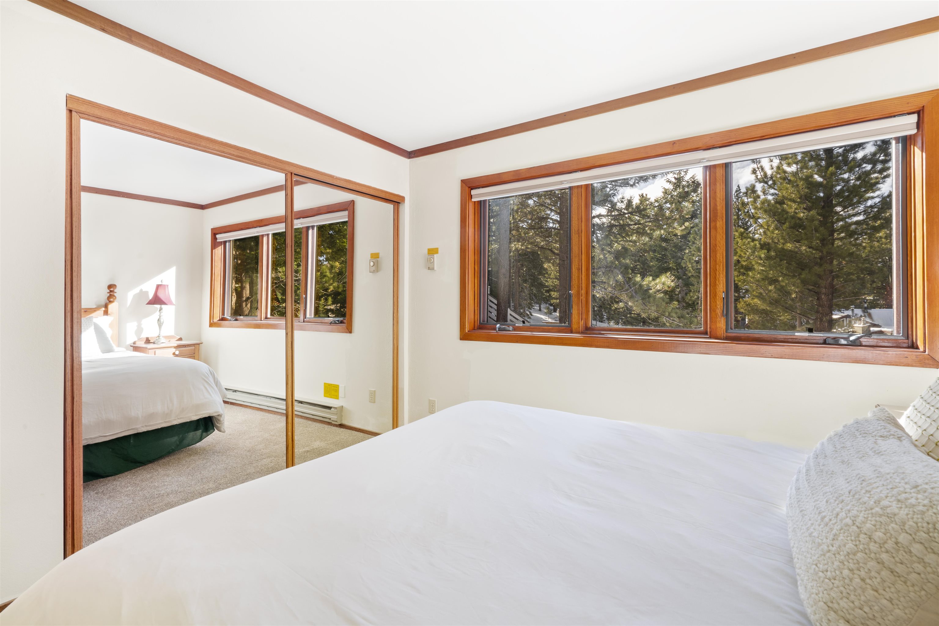36 Ski Trails Road, Unit 8 Mammoth Lakes, CA 93546 - Photo 16 of 29 a bedroom with a large bed and a large window