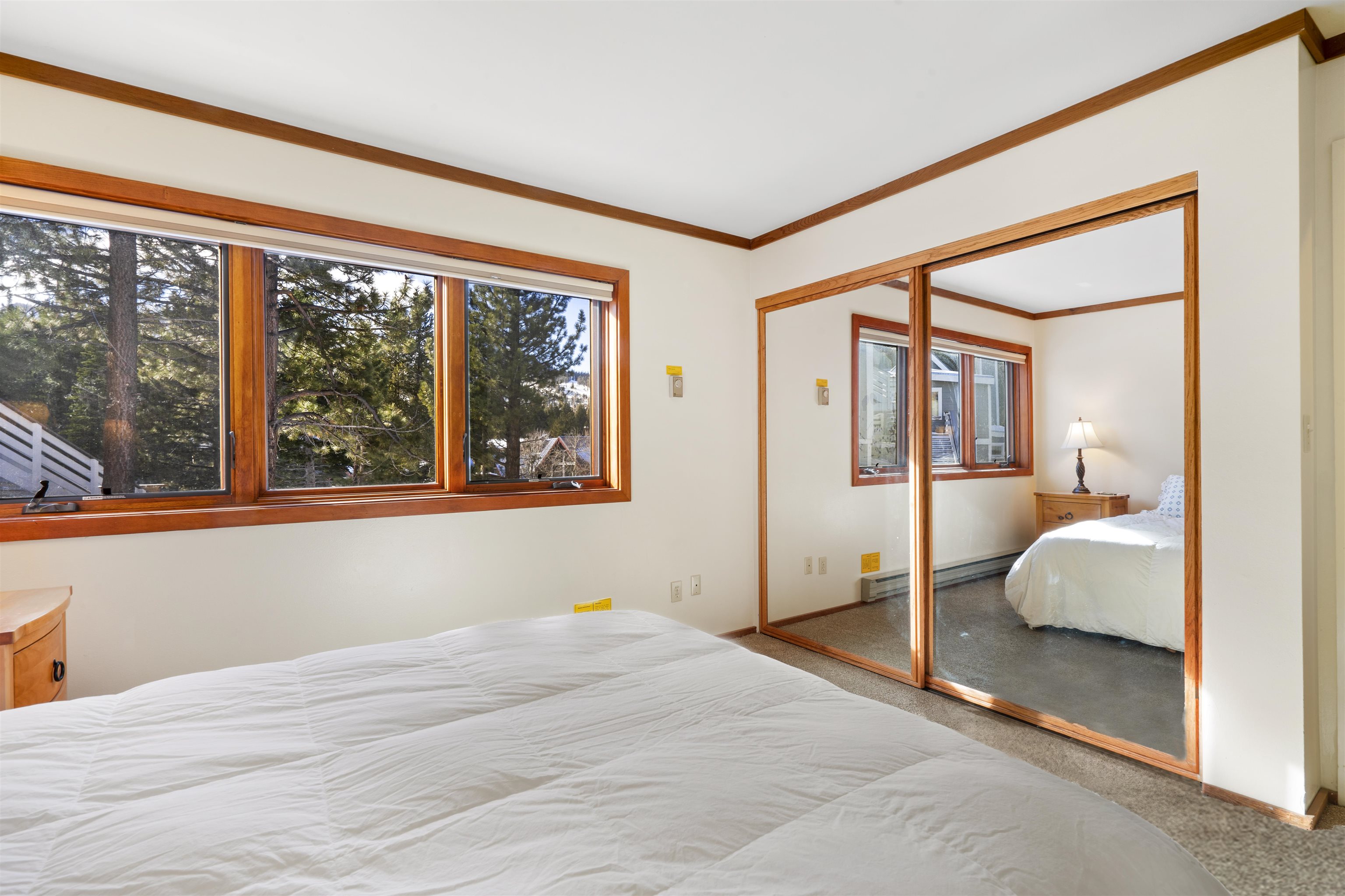 36 Ski Trails Road, Unit 8 Mammoth Lakes, CA 93546 - Photo 19 of 29 a bedroom with a large bed and a large window
