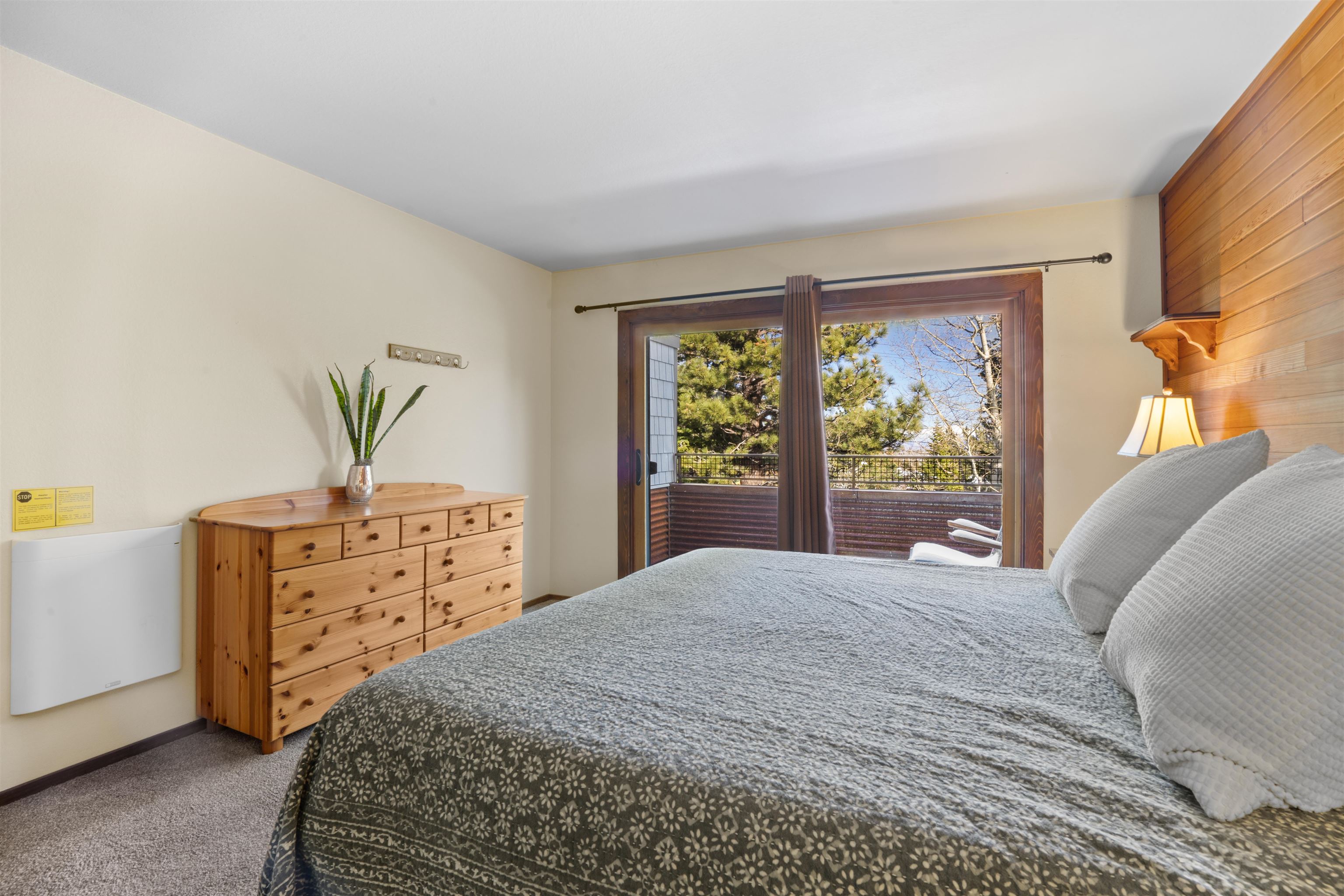 36 Ski Trails Road, Unit 8 Mammoth Lakes, CA 93546 - Photo 21 of 29 a bedroom with a bed and a dresser next to a window