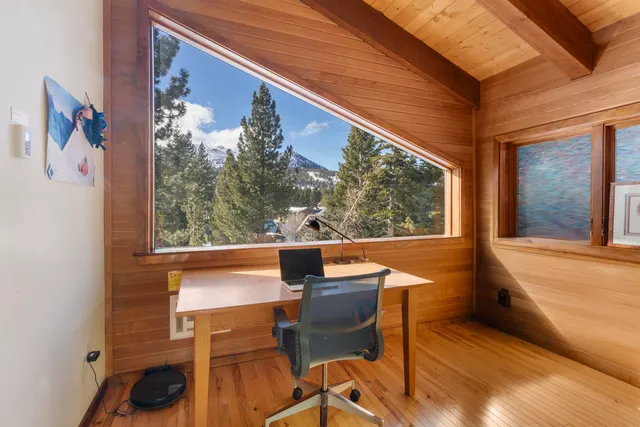 a view of a chairs and table in a balcony