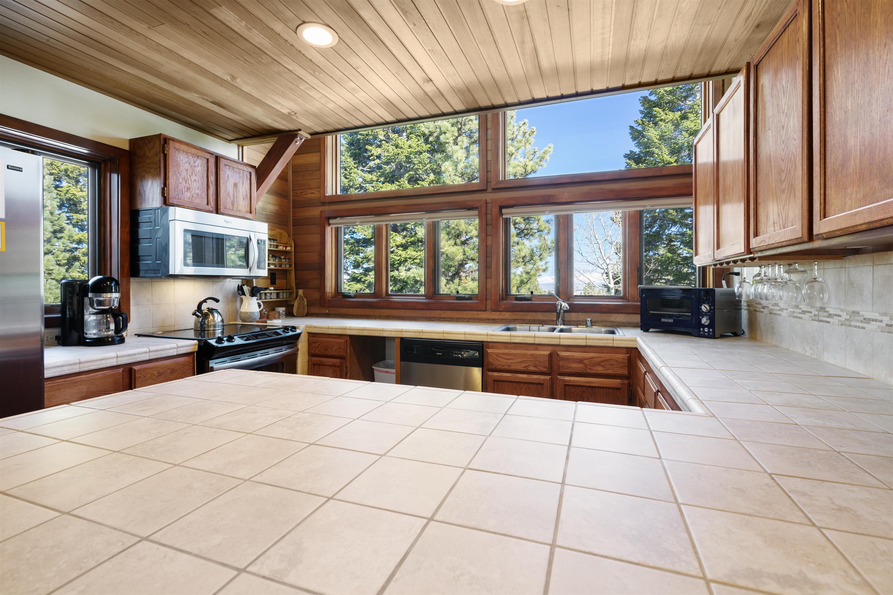 36 Ski Trails Road, Unit 8 Mammoth Lakes, CA 93546 - Photo 9 of 29 a large white kitchen with a large window