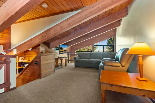 a balcony with furniture and a potted plant
