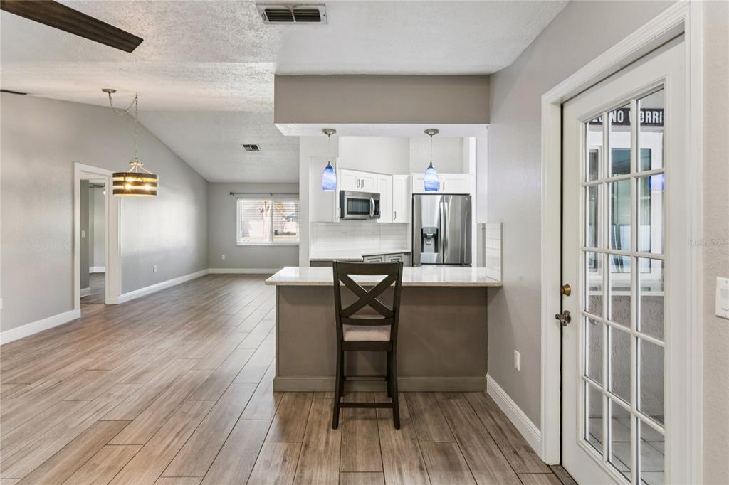 8357 Matthew Drive New Port Richey, FL 34653 - Photo 27 of 78 a view of a livingroom with furniture and wooden floor
