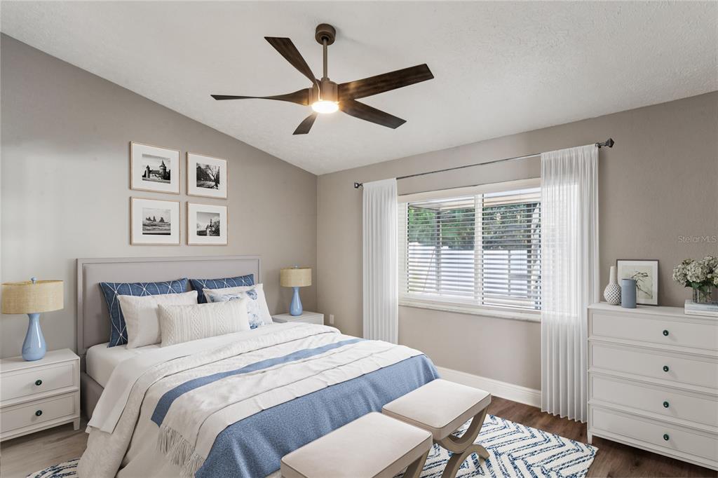 8357 Matthew Drive New Port Richey, FL 34653 - Photo 28 of 78 a bedroom with a bed and a window