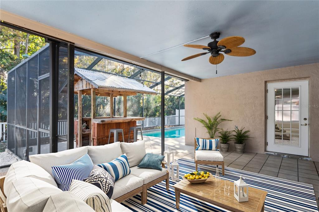 8357 Matthew Drive New Port Richey, FL 34653 - Photo 45 of 78 a living room with furniture and a floor to ceiling window