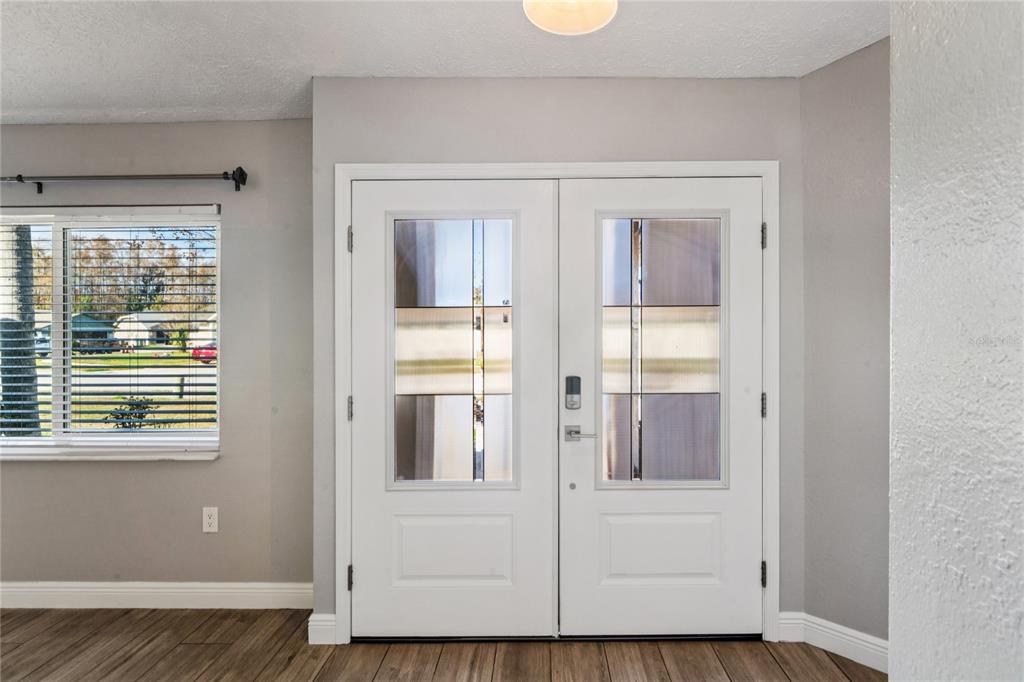 8357 Matthew Drive New Port Richey, FL 34653 - Photo 5 of 78 a view of an entryway with wooden floor