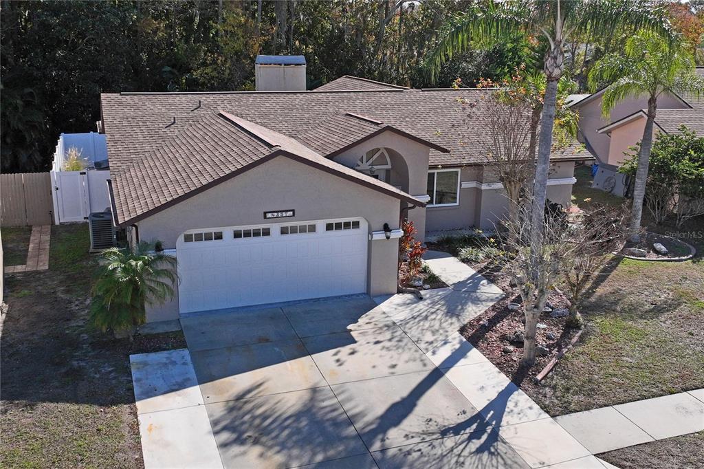 8357 Matthew Drive New Port Richey, FL 34653 - Photo 69 of 78 a house with trees in front of it