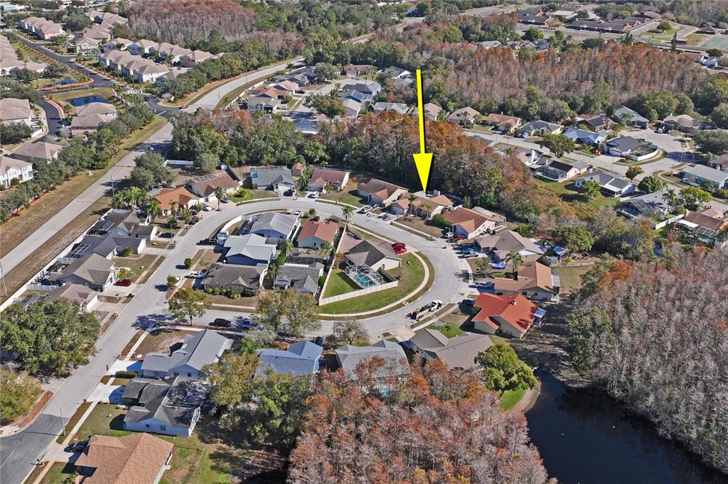 8357 Matthew Drive New Port Richey, FL 34653 - Photo 73 of 78 an aerial view of a house with a swimming pool